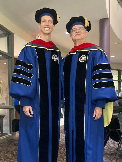 "Andrews University doctoral gown in Admiral blue with gold trim.".