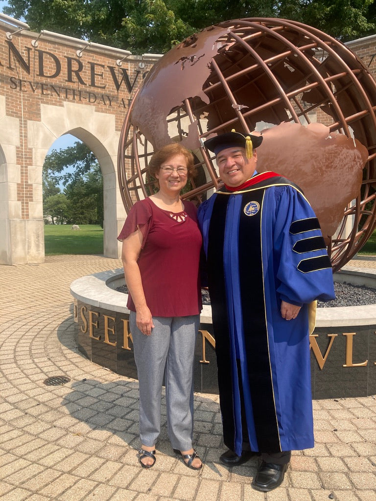 "Andrews University doctoral gown in Admiral blue with gold trim.".